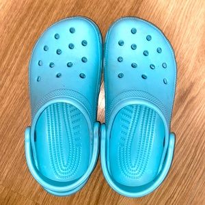 Teal colored Crocs